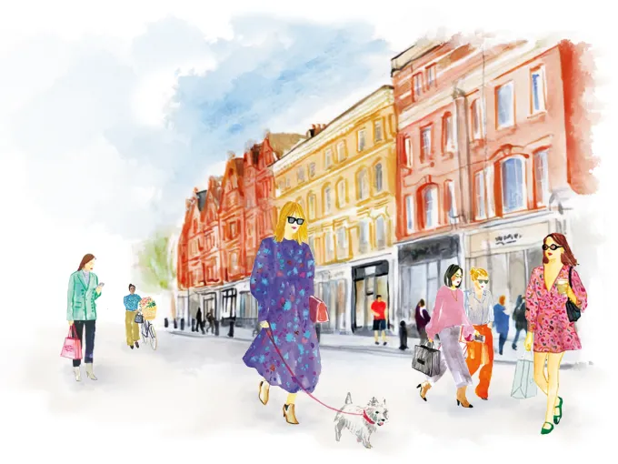 Women shopping and walking a dog on Chelsea’s King’s Road, conveying a lively neighborhood atmosphere.