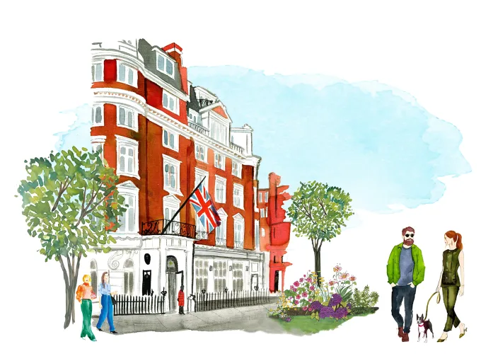 Chelsea streetscape with a boutique hotel flying a Union Jack and pedestrians