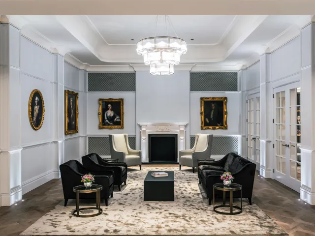 Elegant hotel lounge serving as a formal reception and waiting area.