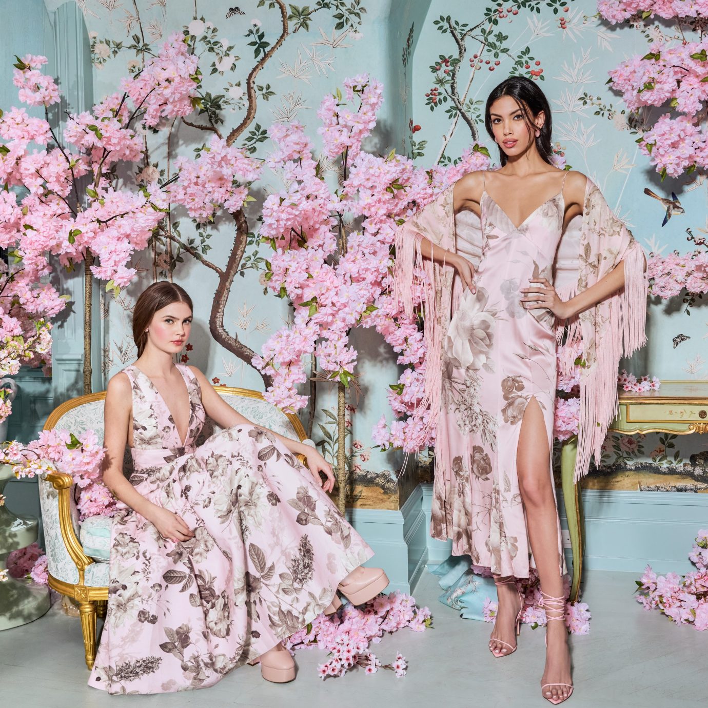 Two models showcasing spring floral dresses for alice + olivia campaign