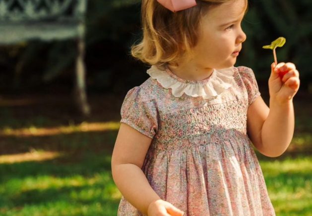Toddler girl modeling an Amaia Kids smocked dress