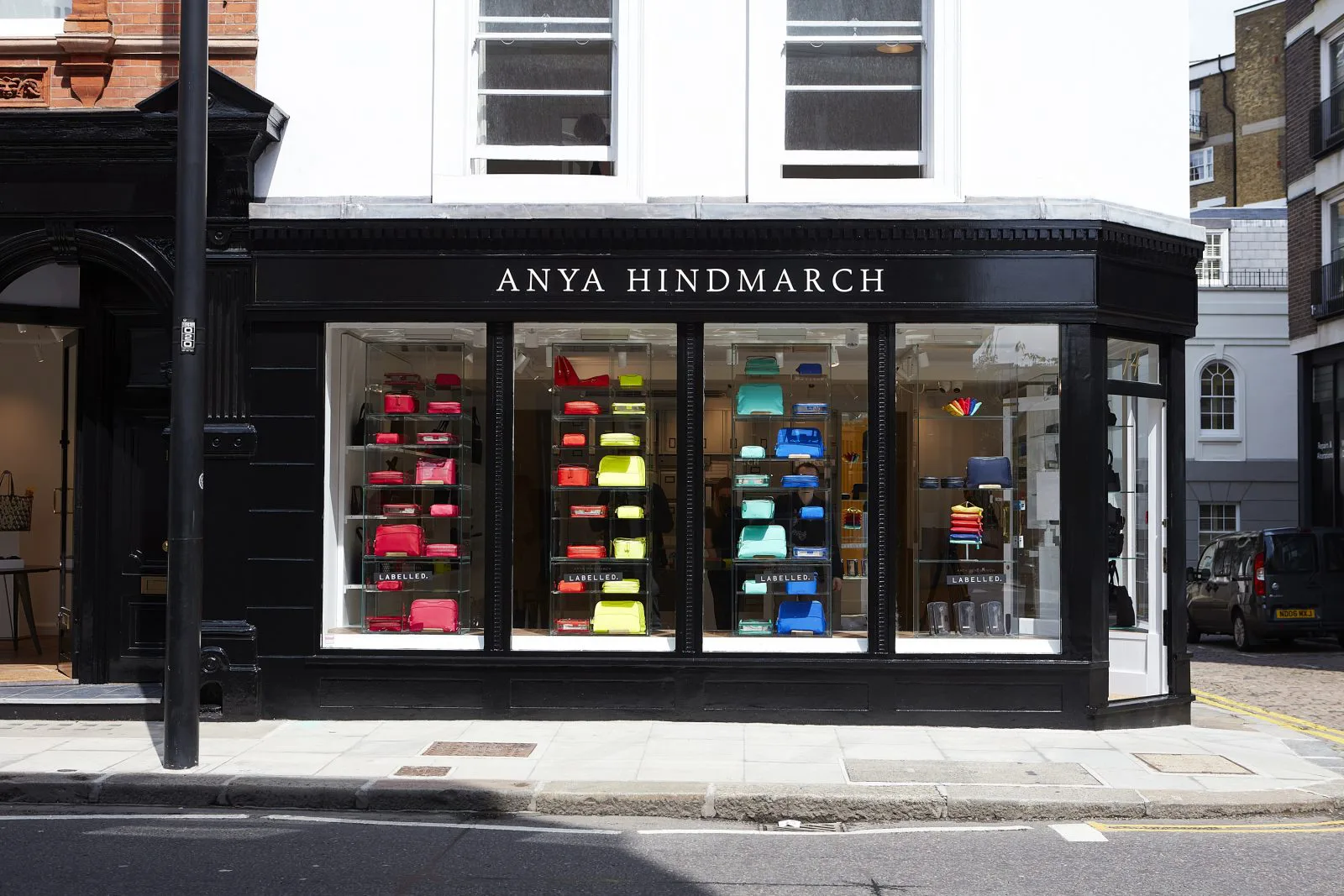 Anya Hindmarch storefront with retail display of designer handbags