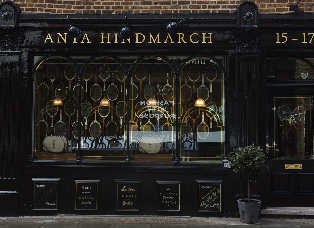 Anya Hindmarch boutique storefront offering bespoke leather accessories and travel goods