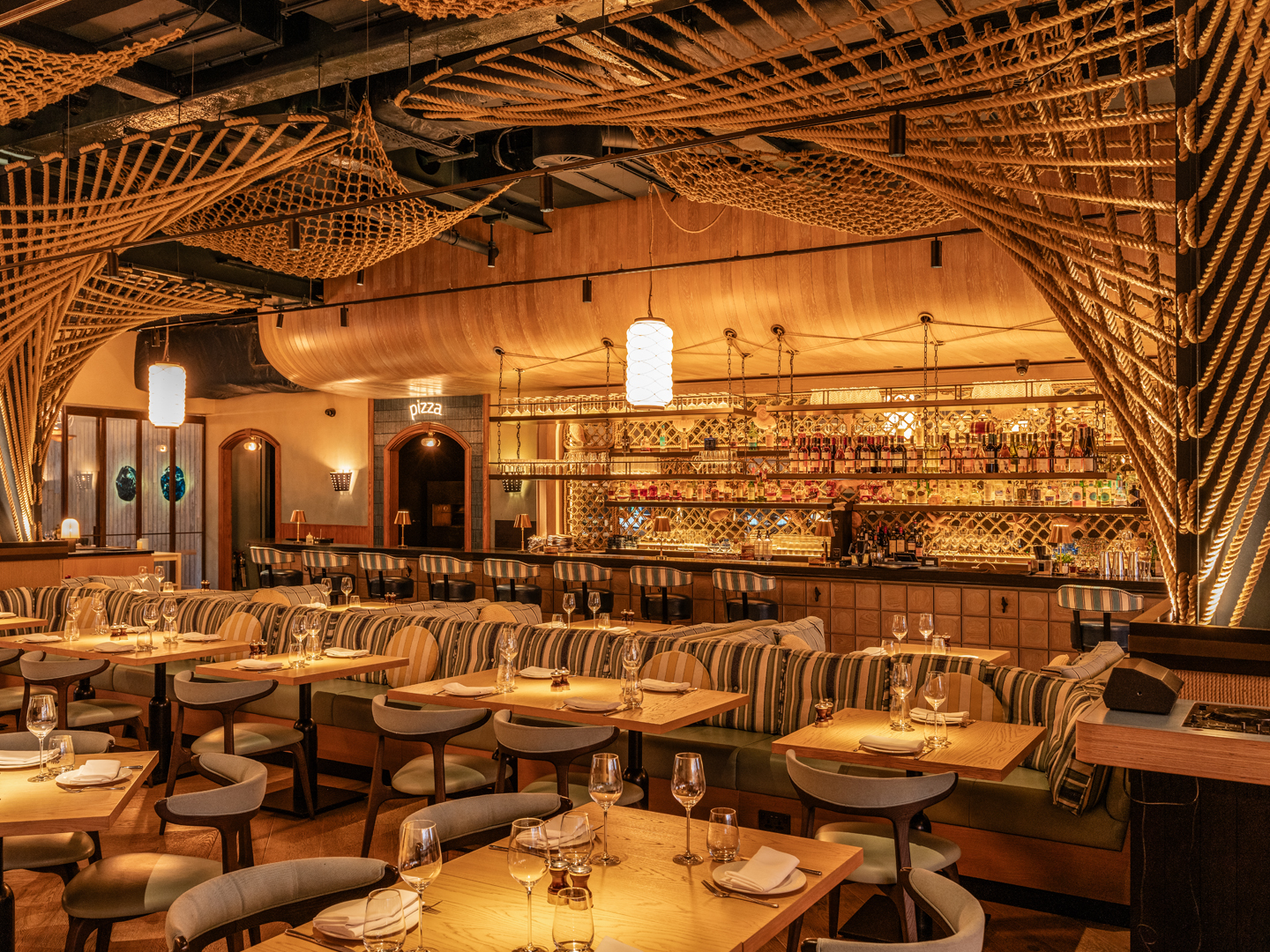 Azzurra restaurant interior conveys a warm, nautical-inspired dining atmosphere.
