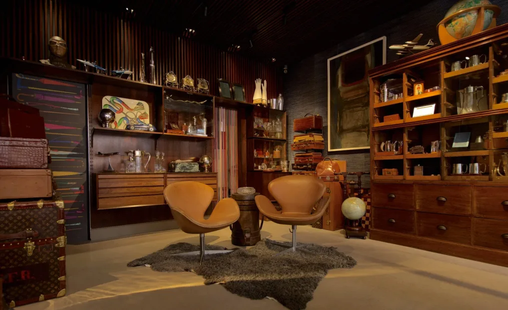 Bentleys luxury travel showroom evoking a vintage study with curated luggage and collectibles