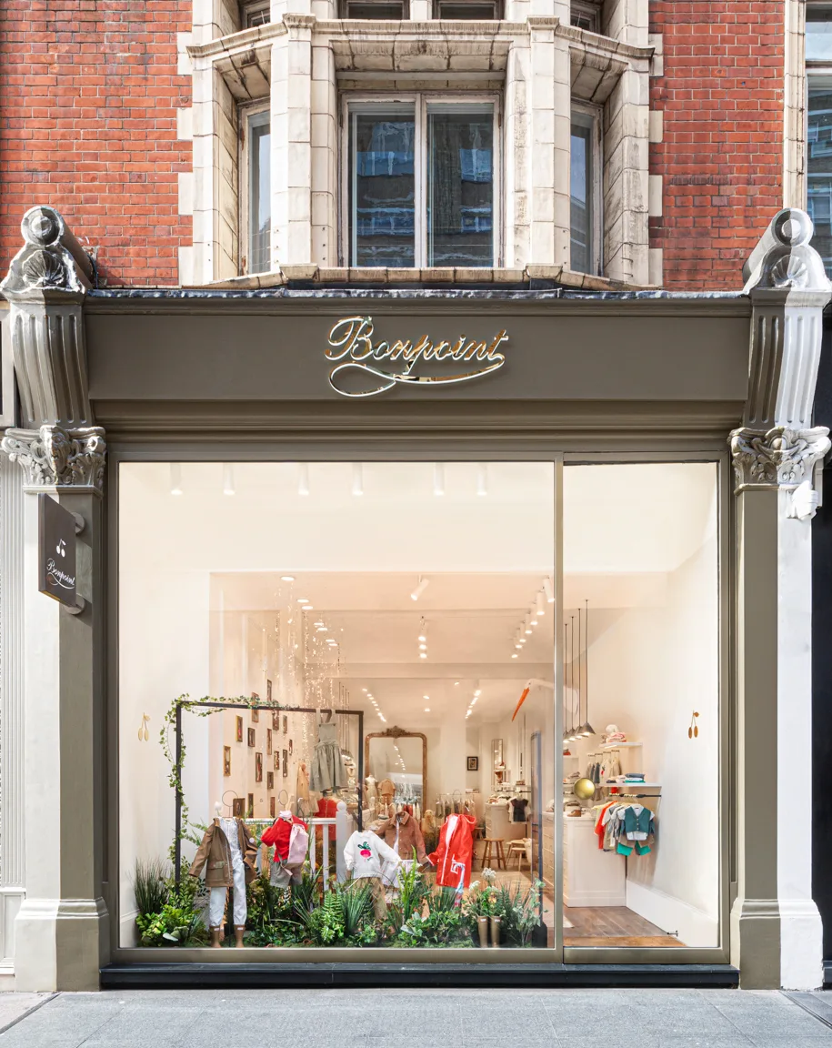Bonpoint boutique storefront showcasing children's clothing and brand signage
