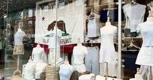 Brandy Melville storefront window advertising casual women's clothing