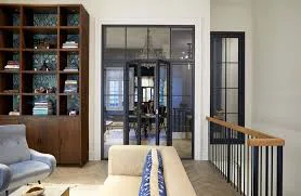 Contemporary living room with glass-paneled doors opening to a dining area