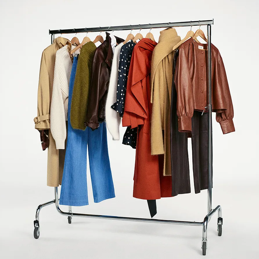 Sezane coming-soon curated wardrobe on a rolling clothing rack