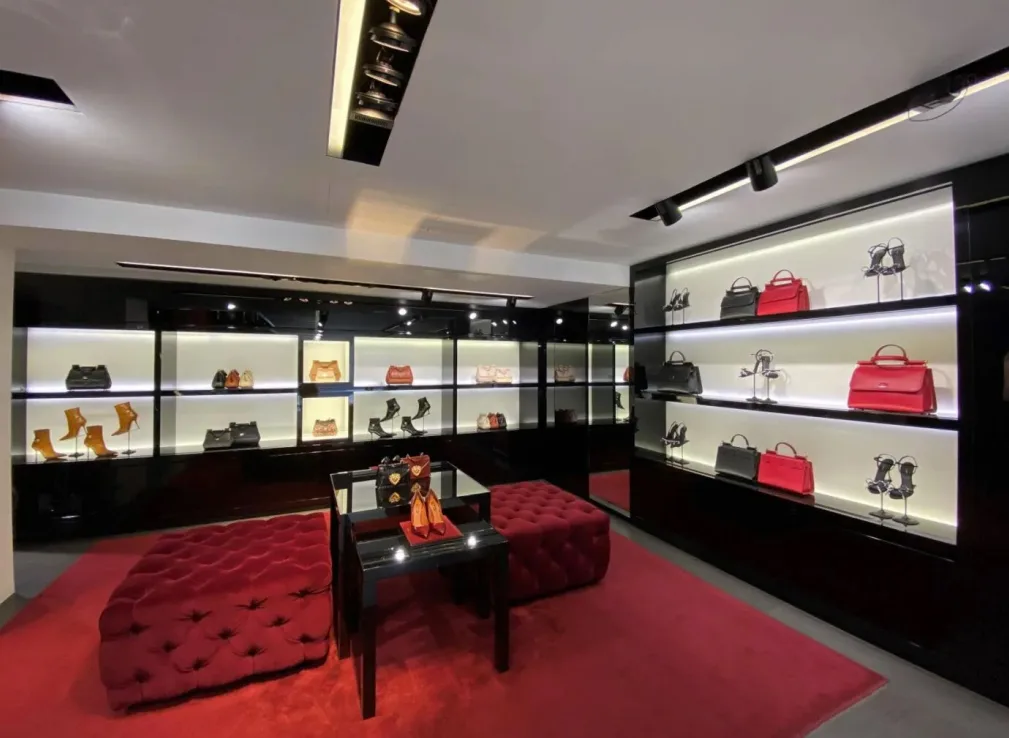 Dolce & Gabbana boutique interior showcasing designer handbags and shoes