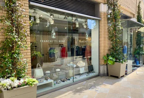 Franchetti Bond clothing boutique storefront on a Chelsea shopping street