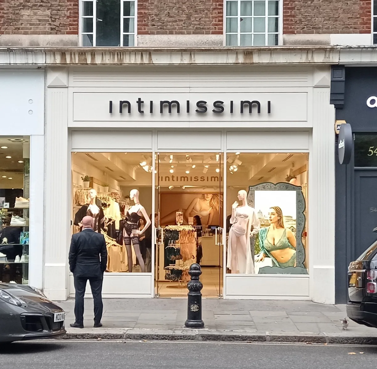 Intimissimi lingerie storefront inviting shoppers with window displays and promotional imagery.