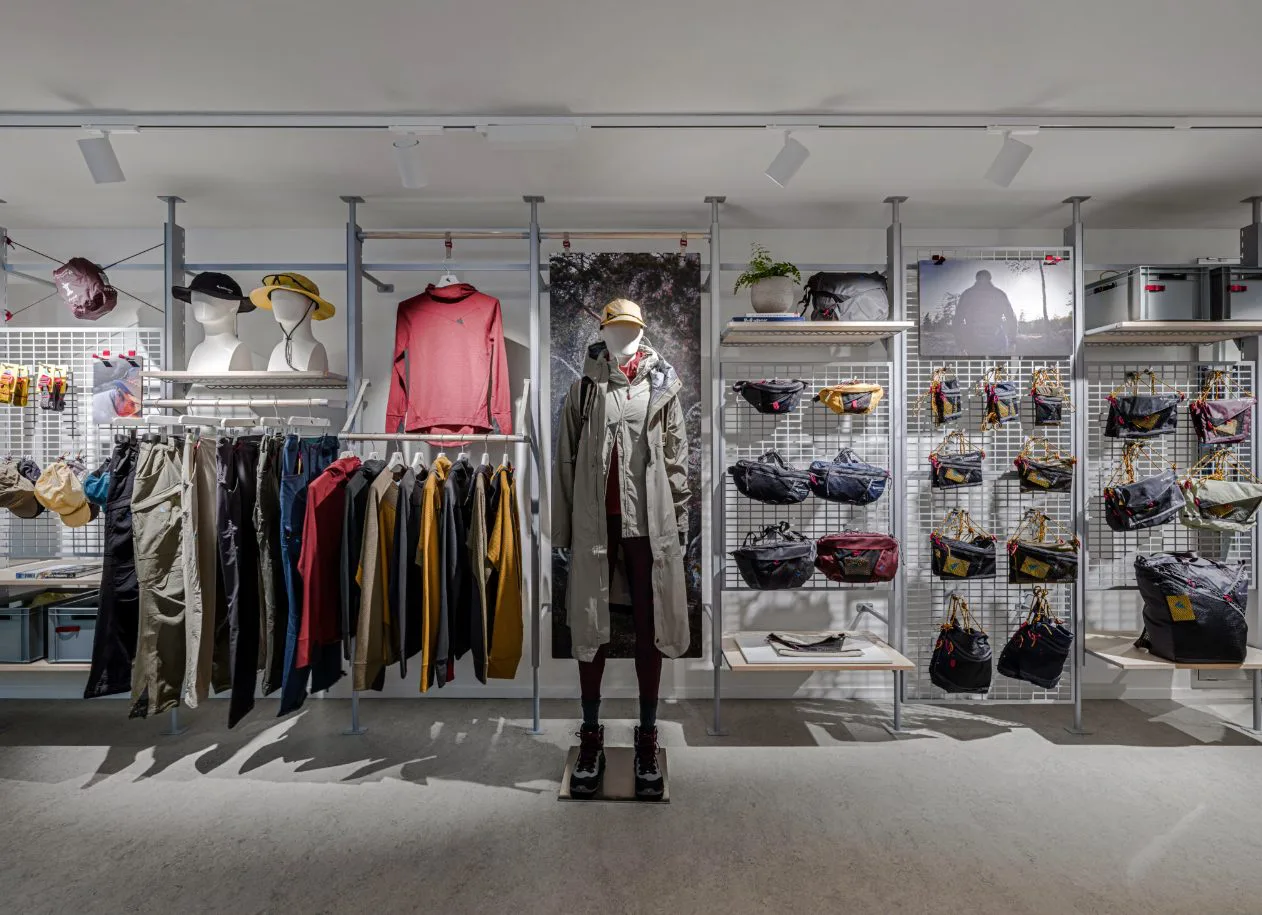 Klättermusen retail display of outdoor apparel and technical packs