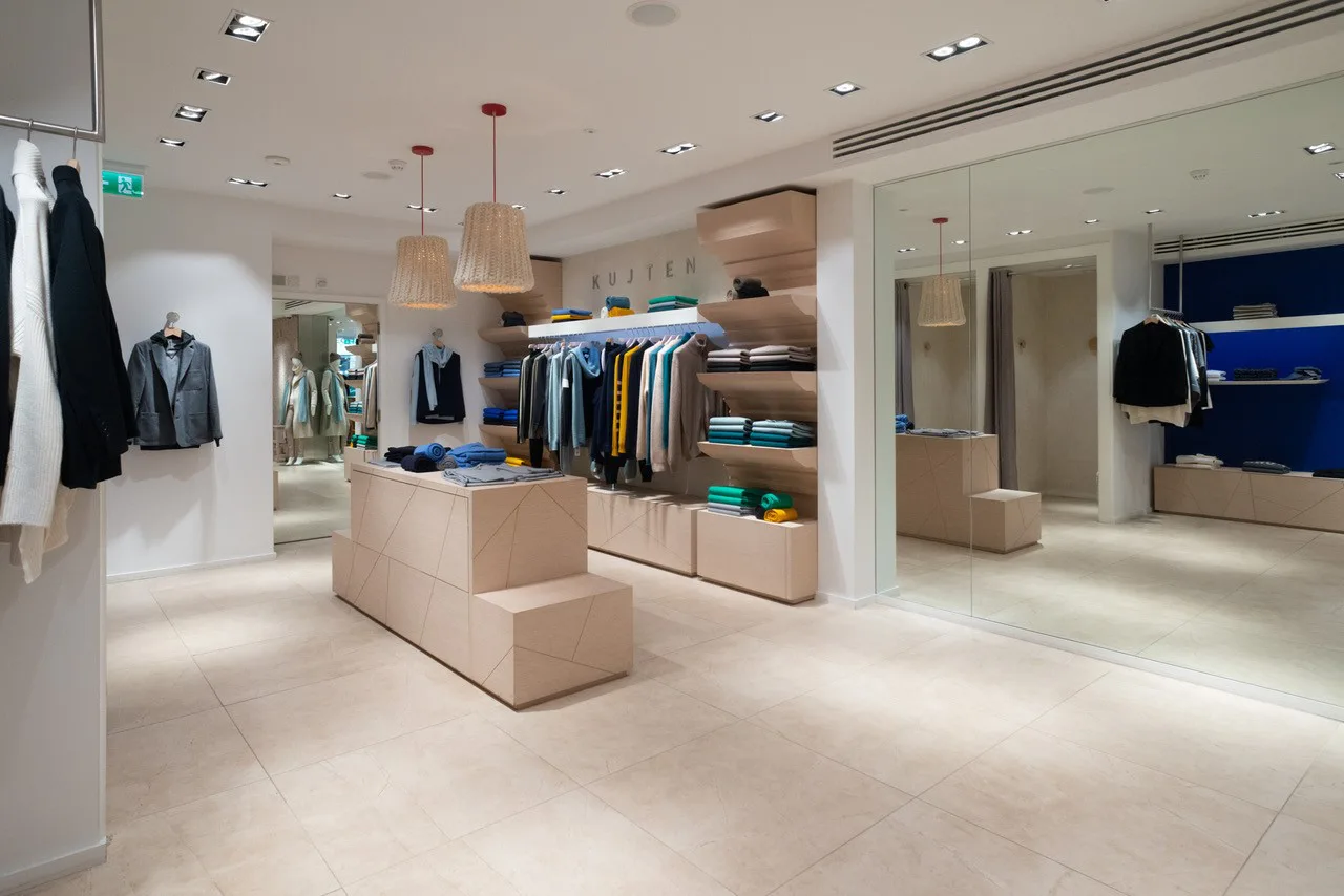 Kujten boutique interior for browsing and trying on clothing.