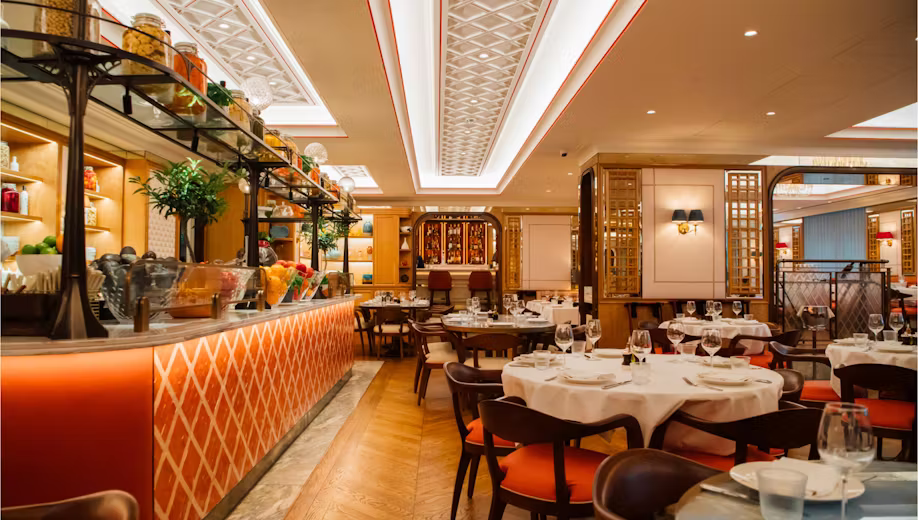 Upscale restaurant dining room prepared for service.