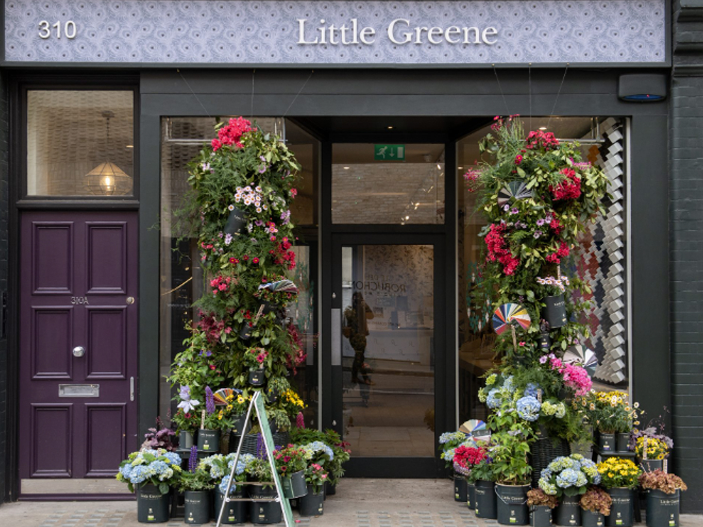 Little Greene storefront with decorative floral display
