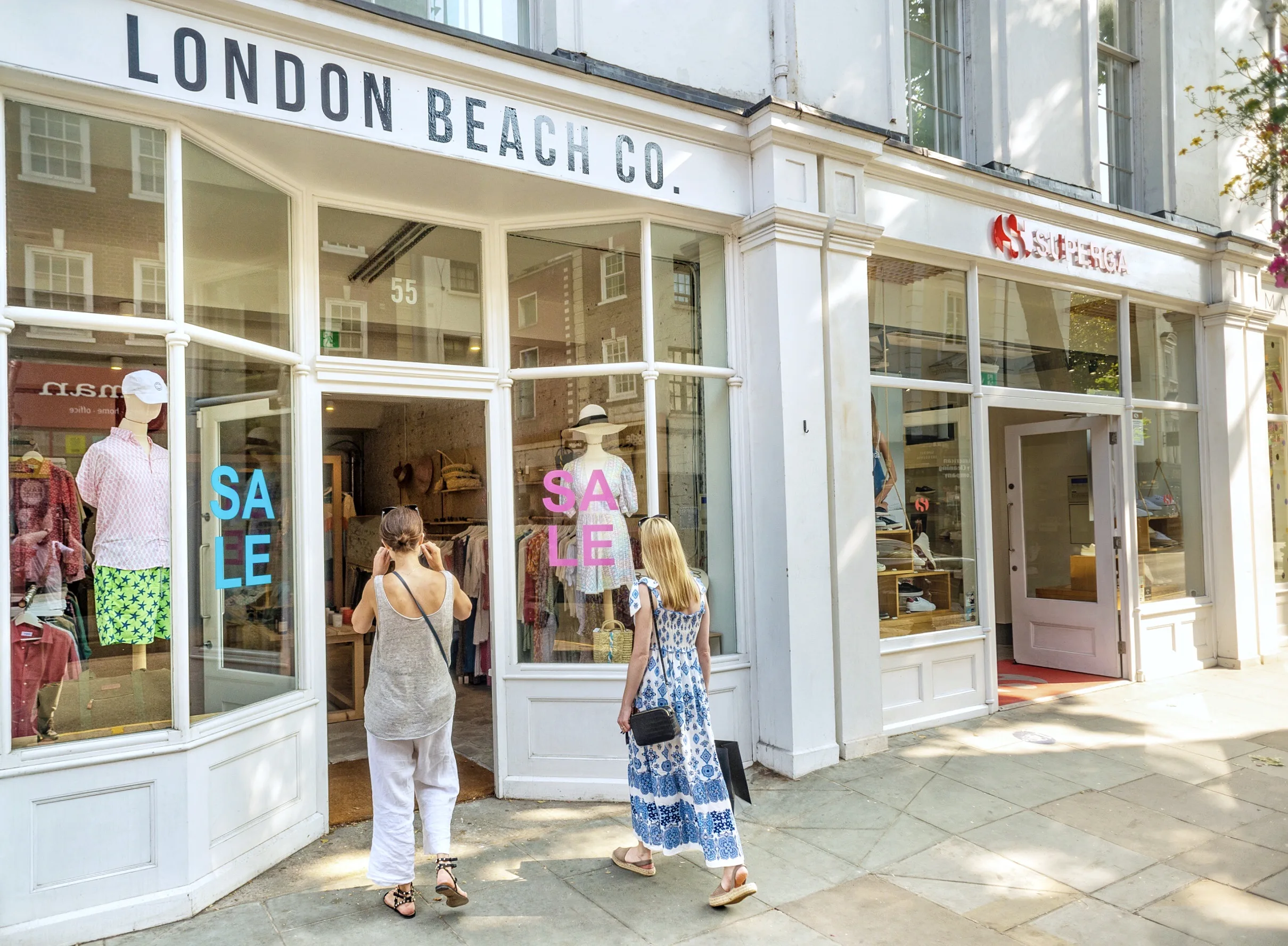 London Beach Co. storefront with shoppers entering during a sale