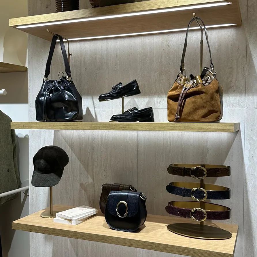 Maison 123 retail display showcasing handbags and accessories for sale.