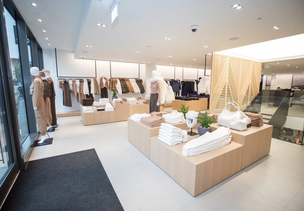 Oska store interior with minimalist displays of women's clothing and accessories