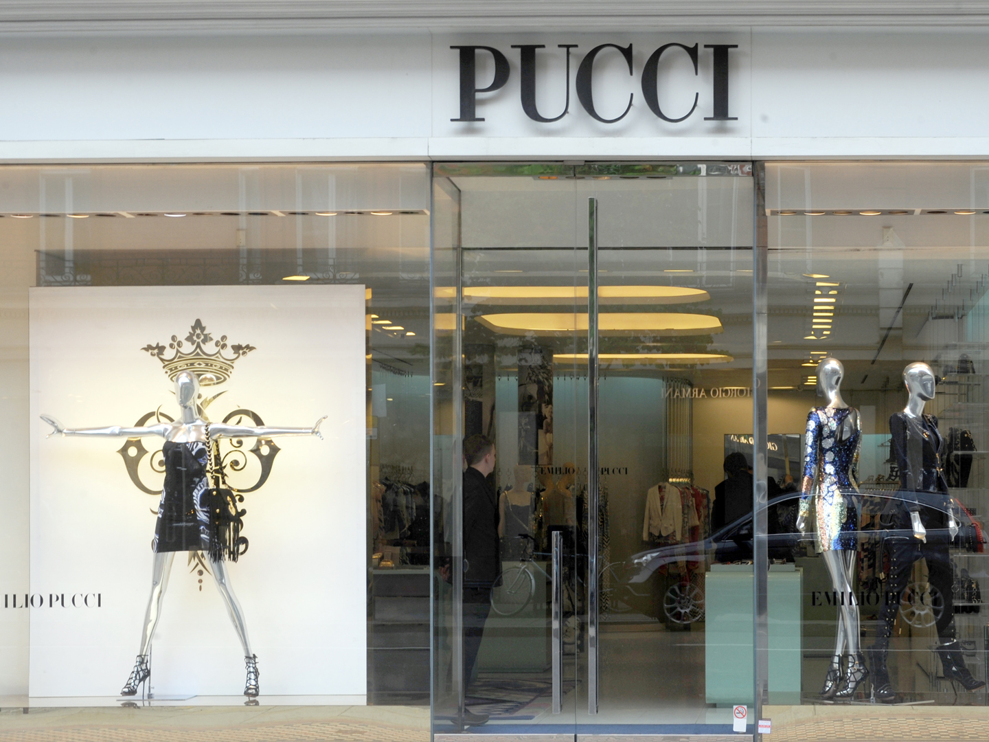 Pucci boutique storefront with mannequins wearing designer clothing