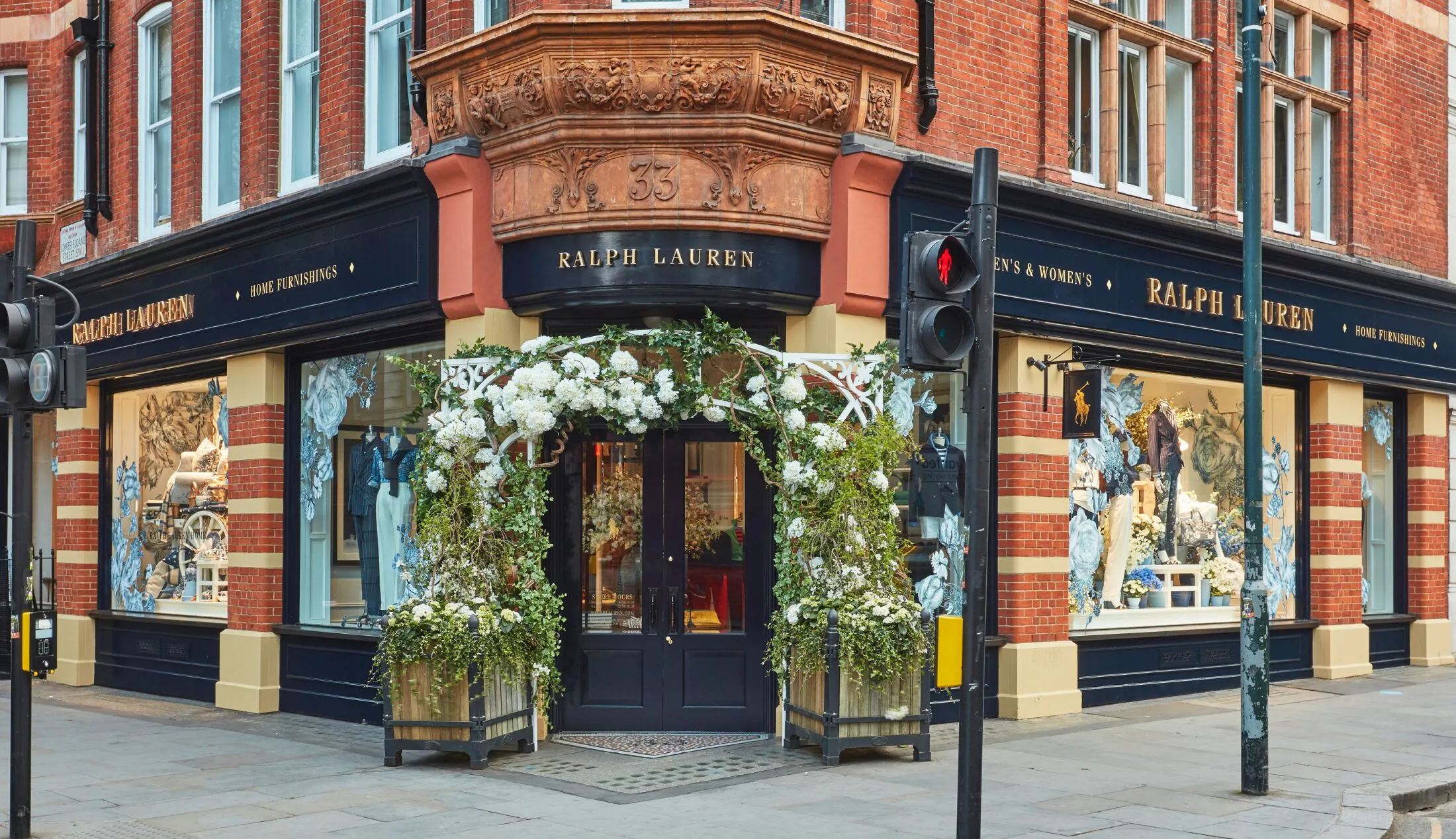 Ralph Lauren storefront with a floral arch marking the main entrance.