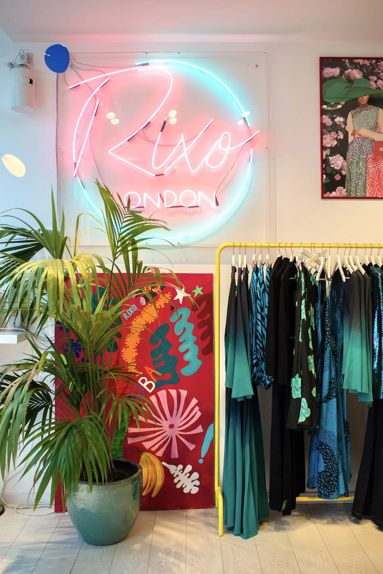 Rixo London boutique interior showcasing women's clothing and brand signage