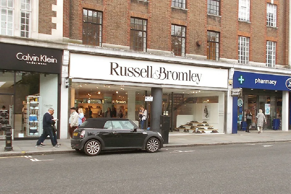 Russell & Bromley shoe boutique storefront on a Chelsea shopping street