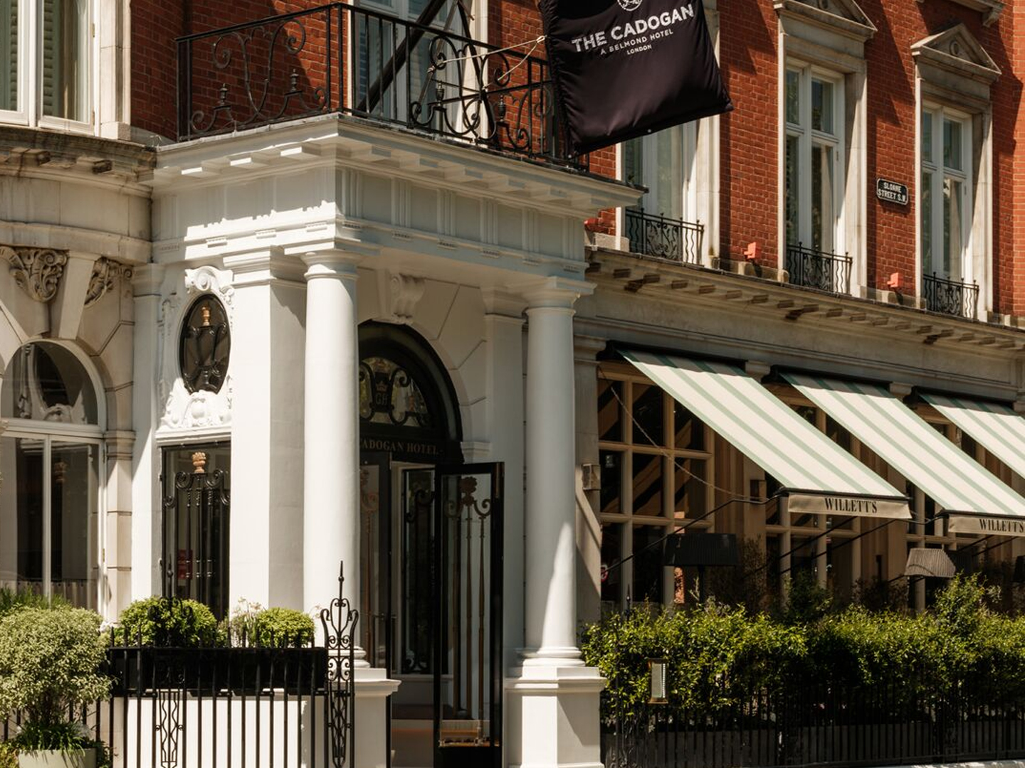 The Cadogan Hotel entrance and adjoining street-level restaurant indicate a boutique Chelsea hotel.