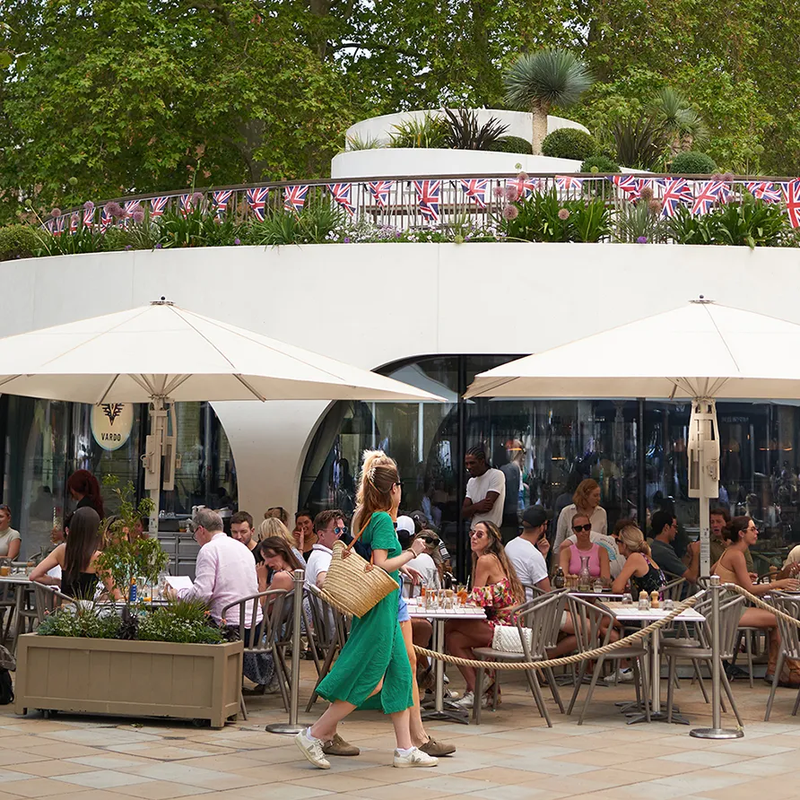 Alfresco dining at Duke of York Square with patrons enjoying outdoor restaurant seating.