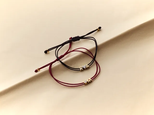 Personalized cord bracelets with initial letter charms