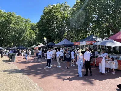 Duke of York Square food market with people browsing outdoor vendor stalls