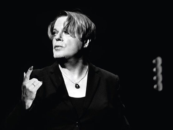 Performer delivering a dramatic interpretation of Shakespeare's Hamlet