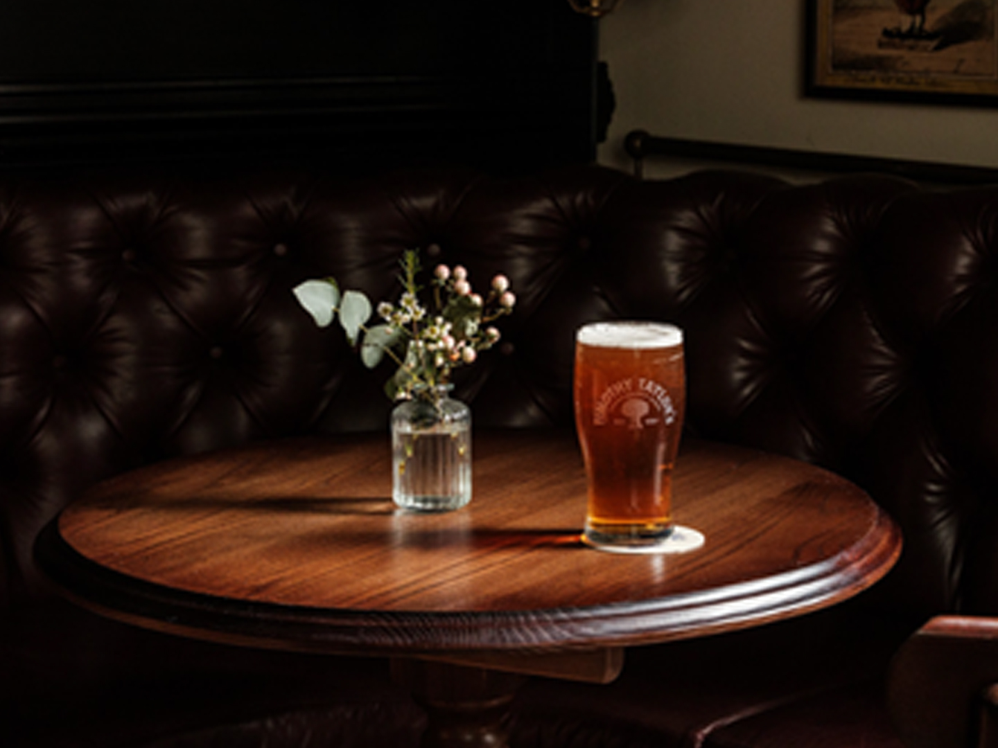 Pint of beer on a pub table promoting the £5 pints offer at The Trafalgar.