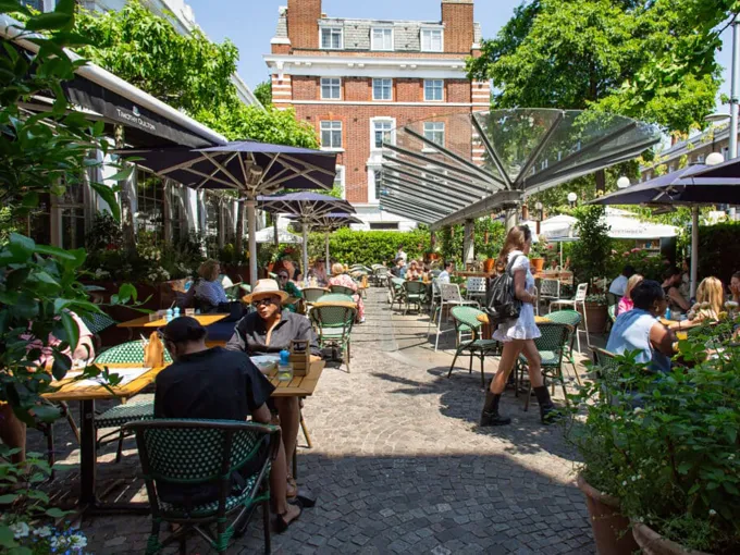 Alfresco restaurant terrace in Chelsea, London where diners enjoy outdoor meals.