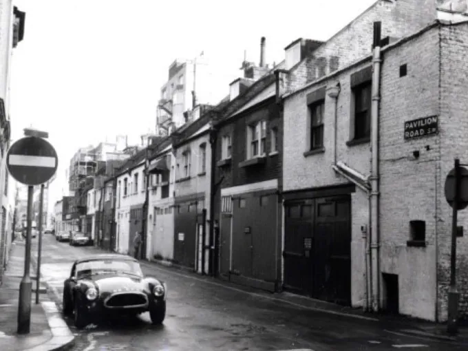 Historic Pavilion Road streetscape with a vintage car evoking a nostalgic local experience.