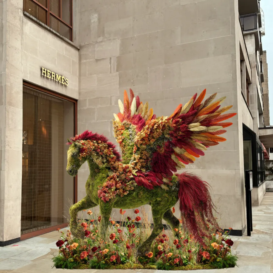 Floral Pegasus sculpture serving as a Chelsea in Bloom installation outside the Hermès storefront