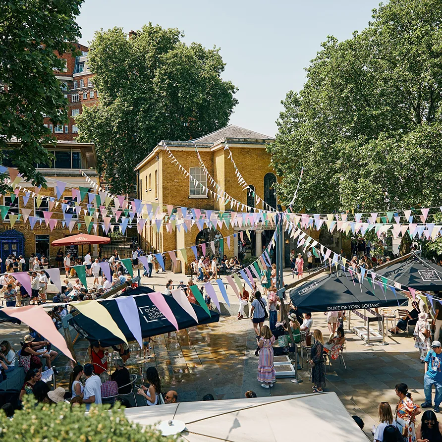 Bustling summer market and outdoor community gathering on King's Road in Chelsea