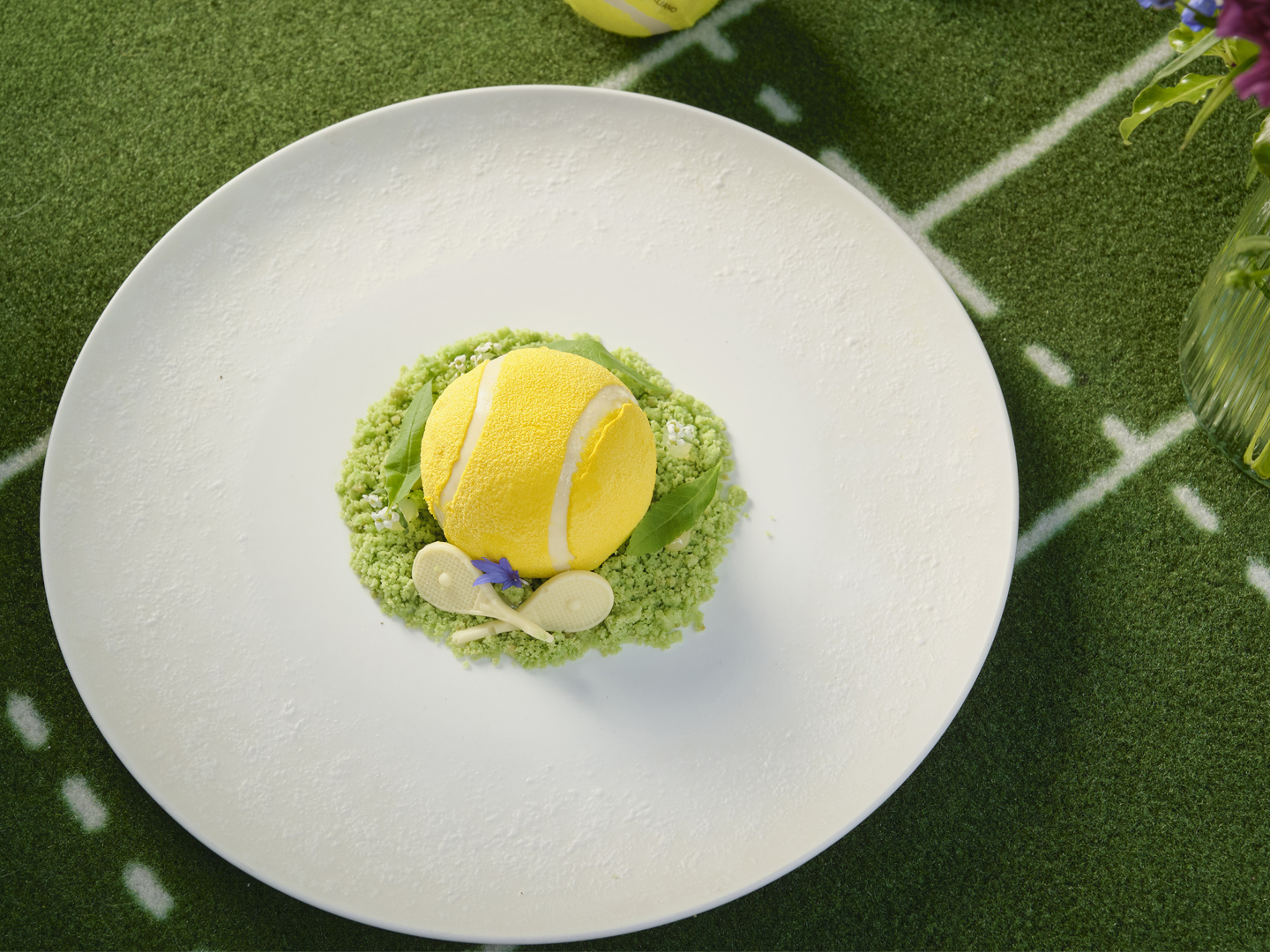 Wimbledon-themed plated dessert shaped like a tennis ball for Azzurra's Game, Set, Spritz.
