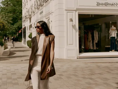 Woman posing outside a luxury boutique on Sloane Street