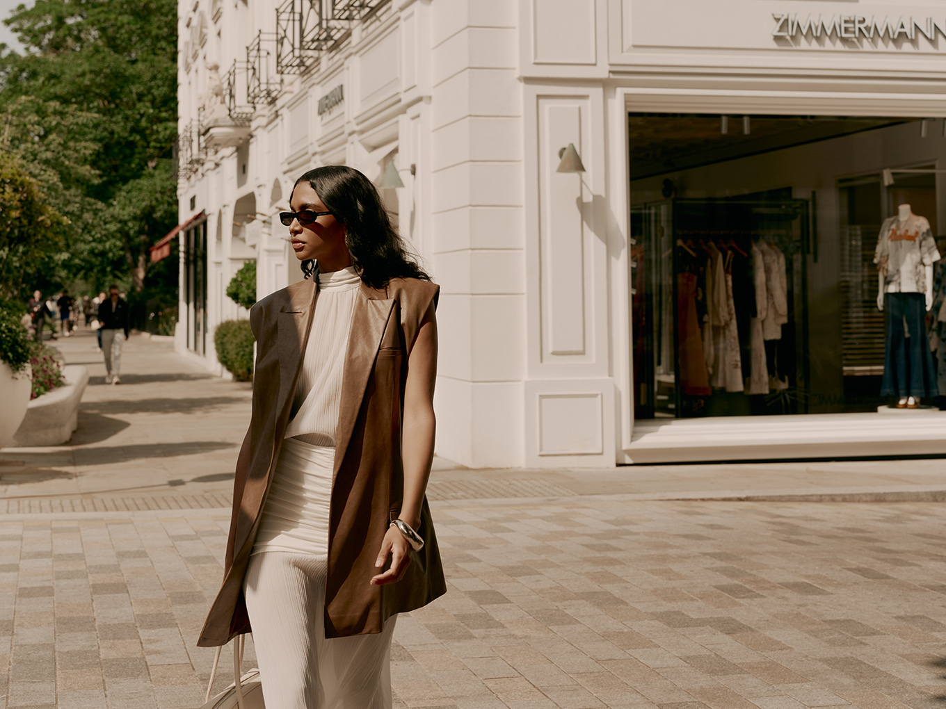Woman posing outside a luxury boutique on Sloane Street