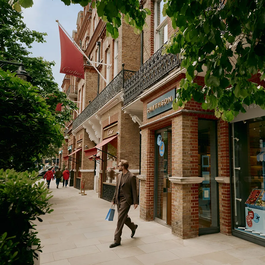 Smythson storefront on Sloane Street representing luxury shopping with a shopper carrying a bag