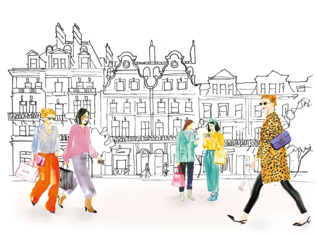 Women shopping and socializing on a fashionable city street.