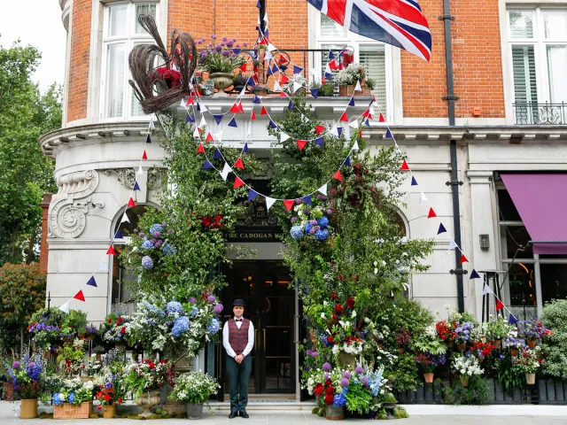 Hotel entrance in Chelsea with a doorman standing to welcome guests.
